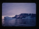 Image of iceberg in sunset colors