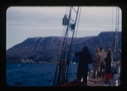 Image of crew on deck, approaching mountains