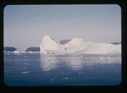 Image of iceberg with glacier beyond