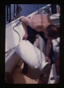 Image of Bill Powers on deck, preparing water can