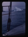 Image of iceberg through rigging