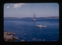 Image of the Bowdoin moored. Dory in foreground