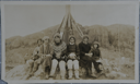 Image of Sukkertoppen flapp[ers] taken during MacMillan Expedition [women sitting at base of flagpole]
