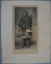 Image of North Alaskan adult female and baby dressed in fur clothing