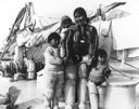 Image of Eskimo [Inuit] Family (Mother and children aboard)