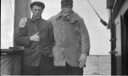Image of Robert Bartlett and  [Rainey]? on deck, smoking pipes