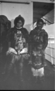 Image of Two Eskimo [Inuit] women and a child on deck