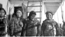 Image of Four Eskimo [Inuit] women on deck, smoking