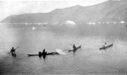 Image of 4 Eskimos [Inuit] in kayaks