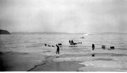 Image of Eskimos [Inuit] with teams on ice floes