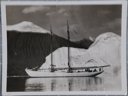 Image of The Schooner Bowdoin in front of iceberg