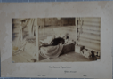 Image of Interior of a log cabin with man in bunkbed with caption The Second Expedition,