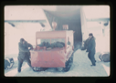 Image of Unloading of weasel snow vehicle from C-130 ski aircraft on Centrum Lake