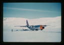 Image of C-130 ski-wheeled aircraft lands personnel and equipment on snow at Centrum Lake