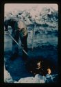 Image of Digging in permafrost at Centrum Lake, snow cover of 2 ft. Use of oil fire to m