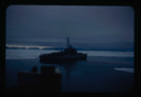 Image of U.S.S. Atka anchored at edge of pack ice near Thule AFB.