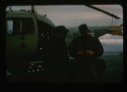 Image of Needleman discusses reconnaissance trip by helicopter with Captain Reinhardt