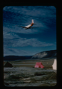 Image of Air Force C-124 flying over runway at low altitude at Bronlunds Fjord 
