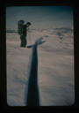 Image of Cabaniss examines hinge crack between ice island T-3 and pack ice 