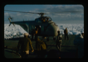 Image of Helicopter from USS Atka icebreaker lands after making reconnaissance