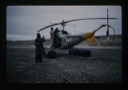 Image of Refueling small helicopter from USS Atka at site of Polaris Promontory.