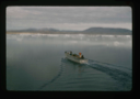 Image of Landing barge headed for shore of Polaris Bay through the floating icebergs