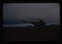 Image of Helicopter from USS Atka picks up jeep trailer and transports it to the base 