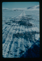 Image of Melting snow mounds on runway on delta at Centrum Lake. Note tents of base camp
