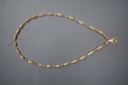Image of Necklace with oblong-shaped beads, small star-shaped beads and 1 large tear-drop