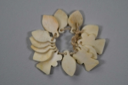 Image of Charm-like ivory ornaments looped together on a string