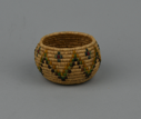 Image of Coiled grass basket with multi-colored design