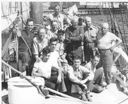 Image of Donald MacMillan and crew on Schooner Bowdoin, Dr. Bailey at Mac's left