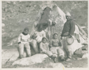 Image of In-you-gee-to, Too-cun-ah, and four children by their tupik