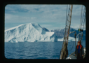 Image of Icebergs through rigging. Miriam MacMillan on deck (2 copies)