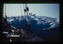 Image of The Bowdoin tied to an iceberg