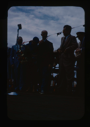 Image of Speakers' Platform on Departure Day. Naval officer, Lowell Thomas, Donald MacMil