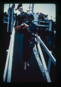 Image of Departure Day. Miriam MacMillan with bouquet, walking down gang plank. Donald Ma