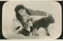 Image of Eskimo [Inuk] with glasses, and month-old musk ox