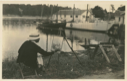 Image of Woman painting picture of the schooner Bowdoin