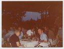 Image of Dinner party on a patio Miriam MacMillan in foreground