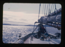 Image of View across Bowdoin's stern. Miriam MacMillan at wheel