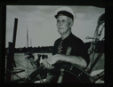 Image of Donald MacMillan sitting at the wheel