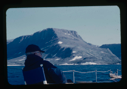 Image of Donald MacMillan sitting on deck at Cape Mugford(2 copies)