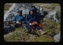 Image of Miriam and Donald MacMillan sitting among Arctic flora (2 copies)