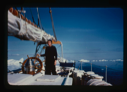Image of Miriam MacMillan at wheel, ice field beyond (2 copies)