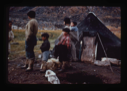 Image of Eskimo [Inuit] family beside their tent