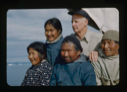 Image of Donald MacMillan, Ootaq, Harrigan [Inukitooq] and two Eskimo [Inughuit] women from North Pole Expedition