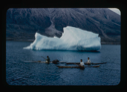 Image of Three kayakers by iceberg, coming to greet the Bowdoin (2 copies).