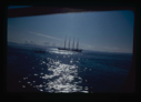Image of Sun on water by 4-masted Portuguese fishing boat