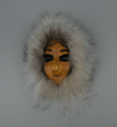 Image of caribou skin mask, female wearing white fur ruff 